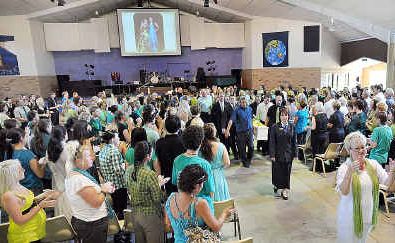 Friends and family stand and clap as Emma Butters’ coffin is carried out of the Hervey Bay Baptist Church. Friends and family stand and clap as Emma Butters’ coffin is carried out of the Hervey Bay Baptist Church.